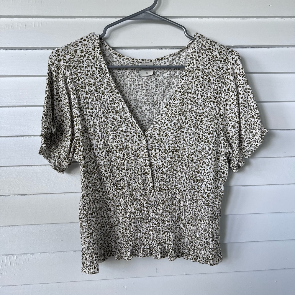 Cropped and smocked floral blouse